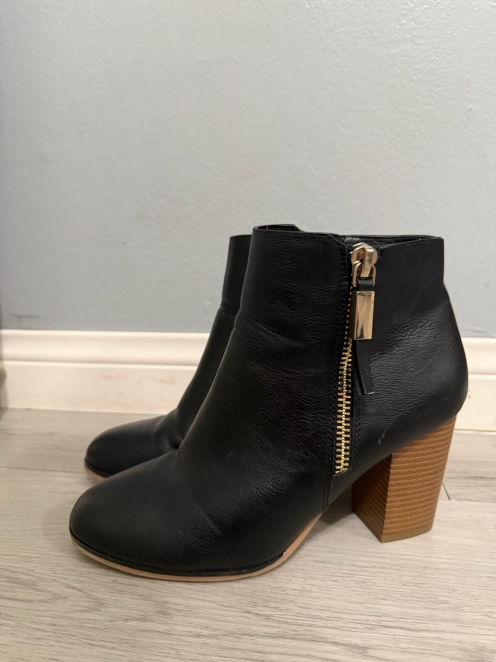 (10) Black Leather Ankle Boot with Gold Zip Accent